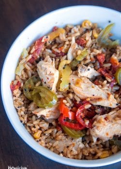 Quick and easy spanish rice bowls using grilled chicken, banana peppers, sundried tomatoes and Seeds of Change Spanish Rice.