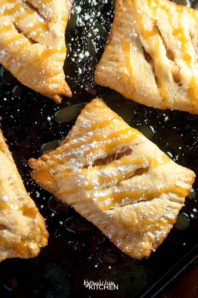 apple turnovers with powdered sugar and caramel drizzle