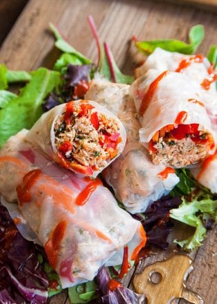 Honey Sriracha Chicken Spring Rolls - this slow cooker dinner recipe uses rice paper wrappers and is not only gluten free but paleo and 21 day fix approved as well. | TheBewitchinKitchen.com