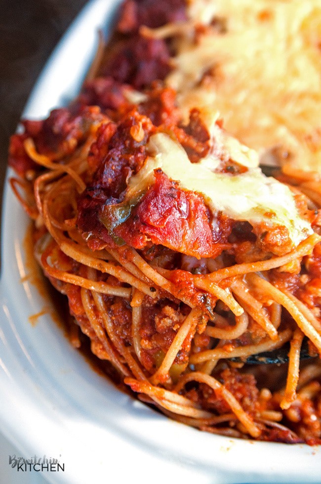 This skinny baked spaghetti recipe is a lightened up version of a classic spaghetti casserole. Both healthy and hearty, this wholesome dinner recipe favorite uses ancient grain pasta and the best spaghetti sauce ever. This sauce has tons of vegetables, light cheese (part skim mozzarella), and both ground turkey and turkey Italian sausage. A healthy baked spaghetti recipe is within reach, add it to your meal plan!