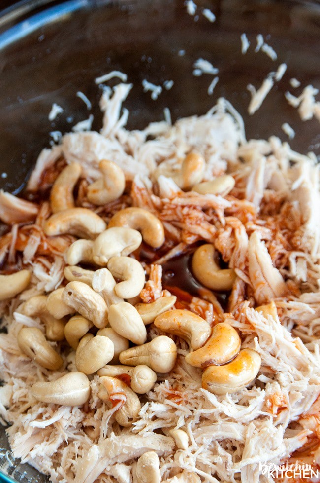 Honey Sriracha Chicken Spring Rolls - this slow cooker dinner recipe uses rice paper wrappers and is not only gluten free but paleo and 21 day fix approved as well. | TheBewitchinKitchen.com