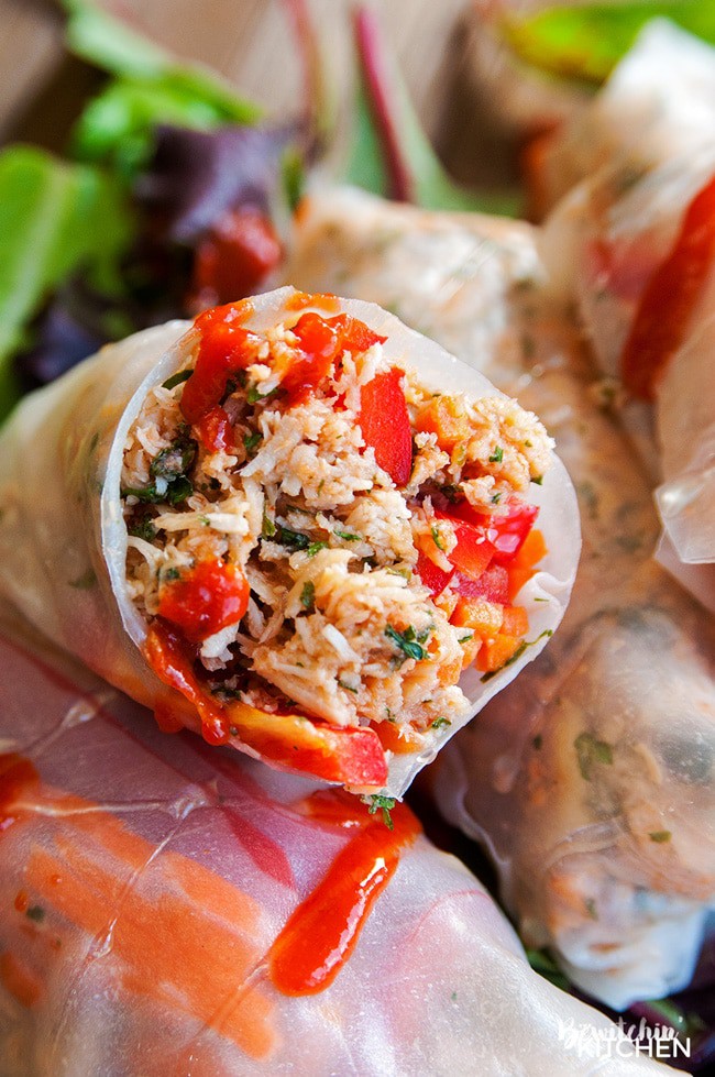 Honey Sriracha Chicken Spring Rolls - this slow cooker dinner recipe uses rice paper wrappers and is not only gluten free but paleo and 21 day fix approved as well. | TheBewitchinKitchen.com