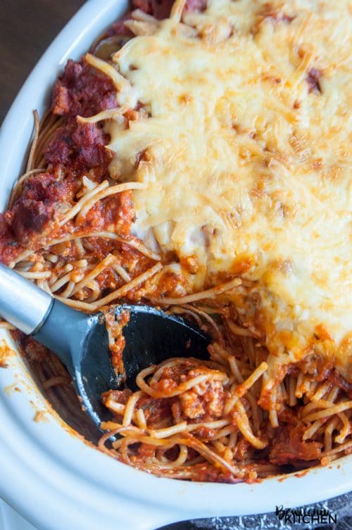 This skinny baked spaghetti recipe is a lightened up version of a classic spaghetti casserole. Both healthy and hearty, this wholesome dinner recipe favorite uses ancient grain pasta and the best spaghetti sauce ever. This sauce has tons of vegetables, light cheese (part skim mozzarella), and both ground turkey and turkey Italian sausage. A healthy baked spaghetti recipe is within reach, add it to your meal plan!