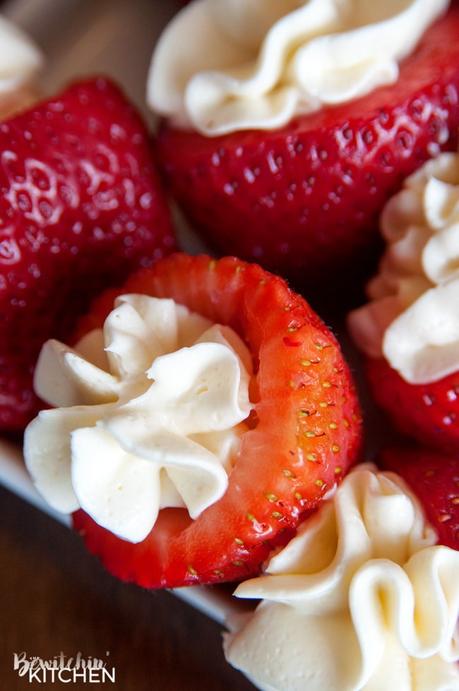 Rum Cheesecake Stuffed Strawberries. This easy, no bake dessert recipe is a party favorite. Cream cheese, sugar and rum extract, topped with crunchy milk chocolate covered pretzels makes this bite sized treat sweet, salty and crunchy. Add this to your popular desserts board.