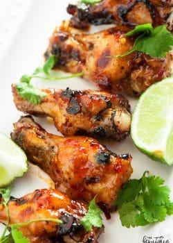 Spicy Thai Chicken Wings - a sweet twist on hot wings using thai chili sauce, limes, sriracha and a few other secret ingredients. A new favorite appetizer for the game, tailgating or a party.