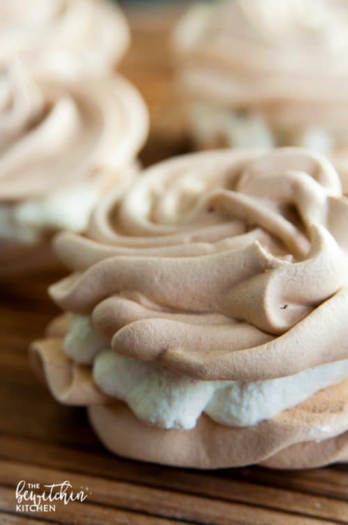 Christmas Meringues filled with an eggnog buttercream frosting. A delicious dessert that is sure to be a hit at holiday parties. They're easy to make too!