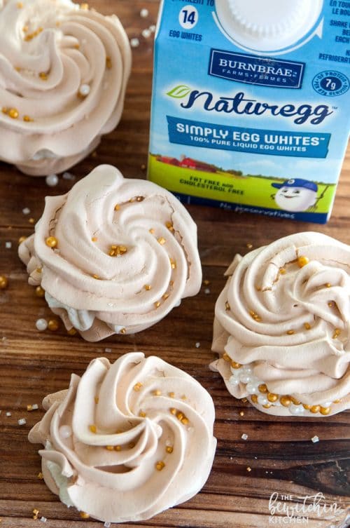 Christmas Meringues filled with an eggnog buttercream frosting. A delicious dessert that is sure to be a hit at holiday parties. They're easy to make too!