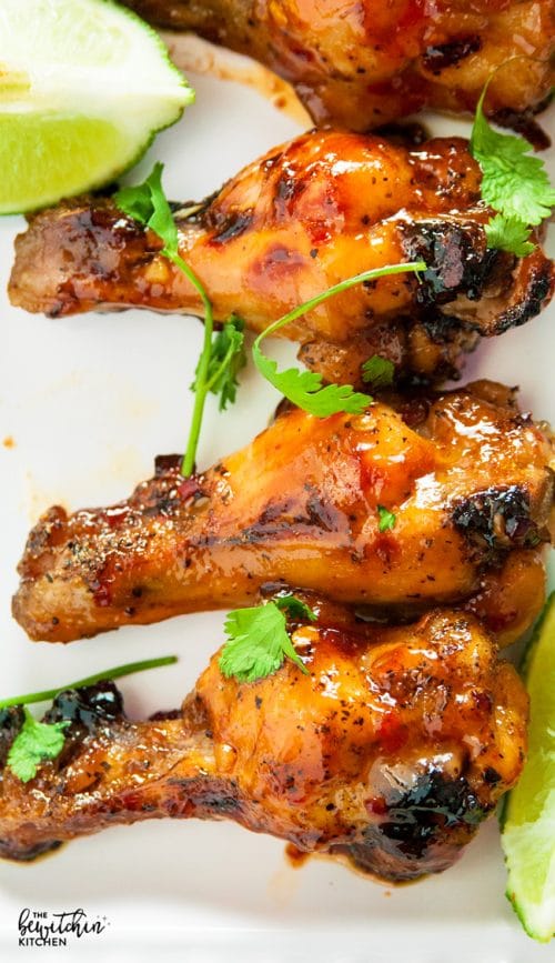 Spicy Thai Chicken Wings - a sweet twist on hot wings using thai chili sauce, limes, sriracha and a few other secret ingredients. A new favorite appetizer for the game, tailgating or a party.