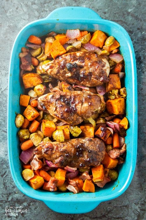 Cranberry balsamic chicken breasts with roasted vegetables. A healthy dinner recipe that uses up leftover cranberry sauce!