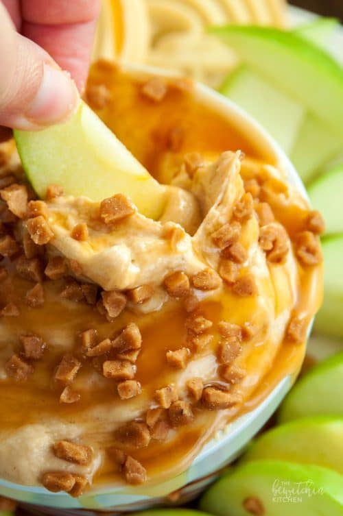 Peanut Butter Dip - calling all peanutbutter lovers! This cream cheese dessert dip is heaven on earth. Goes great with apples or shortbread cookies. I love the crunch of the skor topping too. So darn good! | thebewitchinkitchen.com