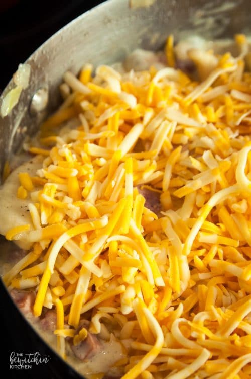 skillet pierogi bake topped with shredded cheese