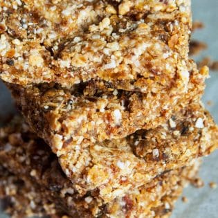 These Coconut Cashew Bars are a new Whole30 snack favorite. I made these with my Vitamix and they were so easy! Dates, coconut, and cashews blended together make a Larabar copycat recipe that's paleo and a healthy snack.