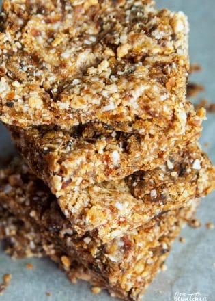 These Coconut Cashew Bars are a new Whole30 snack favorite. I made these with my Vitamix and they were so easy! Dates, coconut, and cashews blended together make a Larabar copycat recipe that's paleo and a healthy snack.
