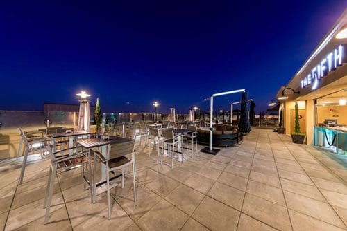 Looking where to dine with kids at Disney? The Fifth OC is a family friendly rooftop bar in Anaheim right across the street from Disneyland.