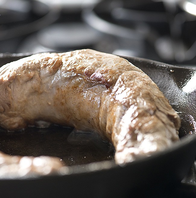 Get this family friendly Skillet Pork Tenderloin on the table in an hour! Cooked in a skillet with fresh rosemary, thyme and garlic. Perfect for a weeknight dinner and elegant enough for a dinner party recipe.