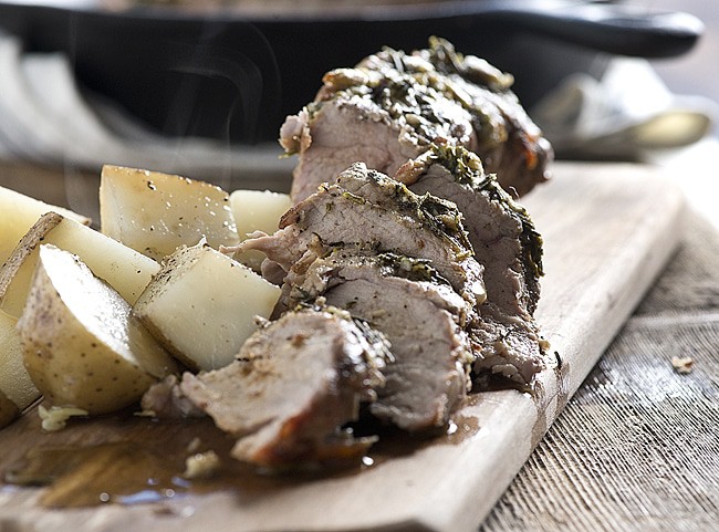 Get this family friendly Skillet Pork Tenderloin on the table in an hour! Cooked in a skillet with fresh rosemary, thyme and garlic. Perfect for a weeknight dinner and elegant enough for a dinner party recipe.