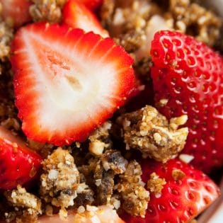 Whole30 dessert idea! Strawberries with coconut cashew crumble - it's so darn yummy. A healthy dessert that's paleo, no bake, and (with only four ingredients) easy to make.