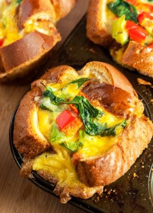 Simple and easy Frittata Cups. This healthy breakfast recipe has eggs, bell peppers, spinach, and cheese all in a breakfast cup shell of bread baked in a muffin tin. 21 Day Fix containers in post.