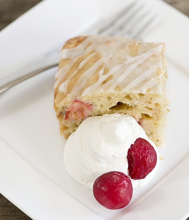 Cherry Oat Breakfast Cake recipe. Cake for breakfast? Yes! This is an easy recipe for a slightly sweet breakfast cake full of wholesome oats, fresh or frozen fruit and finished with a simple glaze.