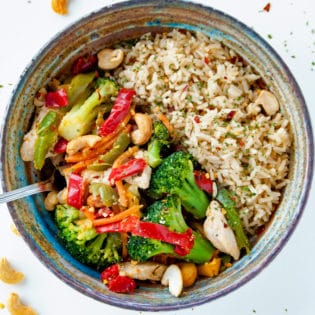 This healthy chicken stir fry takes a few minutes to make and is loaded with ingredients that are Whole30 and Keto Diet compliant (when you get rid of the rice). It's a quick and easy clean eating recipe.