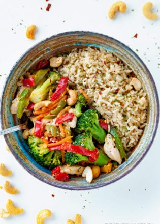This healthy chicken stir fry takes a few minutes to make and is loaded with ingredients that are Whole30 and Keto Diet compliant (when you get rid of the rice). It's a quick and easy clean eating recipe.