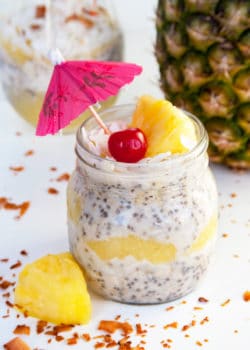 Pina Colada Overnight Oats recipe - This dairy free, gluten free and refined sugar free treat is delicious served warm or cold. This tropical dessert works great as a breakfast or a snack.