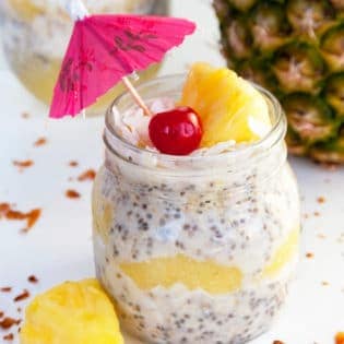 Pina Colada Overnight Oats recipe - This dairy free, gluten free and refined sugar free treat is delicious served warm or cold. This tropical dessert works great as a breakfast or a snack.