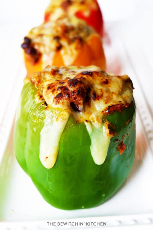 Healthy Chili Stuffed Peppers with Monterey Jack Jalapeno Cheese. Talk about comfort food! This family dinner recipe is easy to throw together, especially with leftover chili!