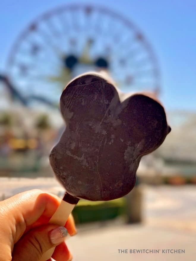 Mickey shaped ice cream at California adventure in front of Mickey's Fun Wheel