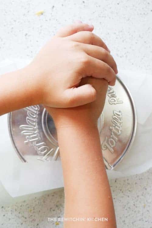 Using a tortilla press to make homemade corn tortillas