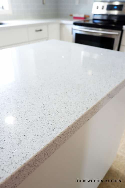 Stellar Snow by Silestone. These are beautiful white quartz countertops with glitter in them!