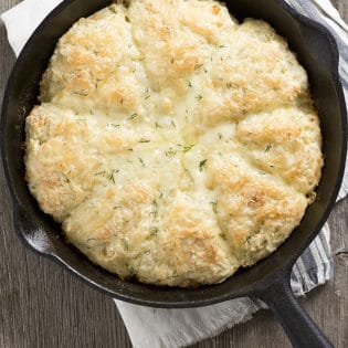 An easy recipe for Skillet Dill and Cheddar Buttermilk Scones, using garden fresh dill and extra old cheese! The perfect lunch or tea break treat!