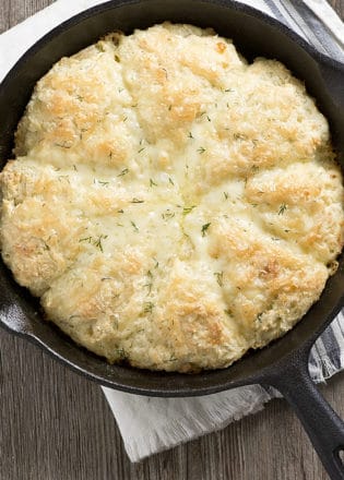 An easy recipe for Skillet Dill and Cheddar Buttermilk Scones, using garden fresh dill and extra old cheese! The perfect lunch or tea break treat!