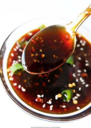 overhead of a spoon scooping Korean bbq sauce our of a bowl