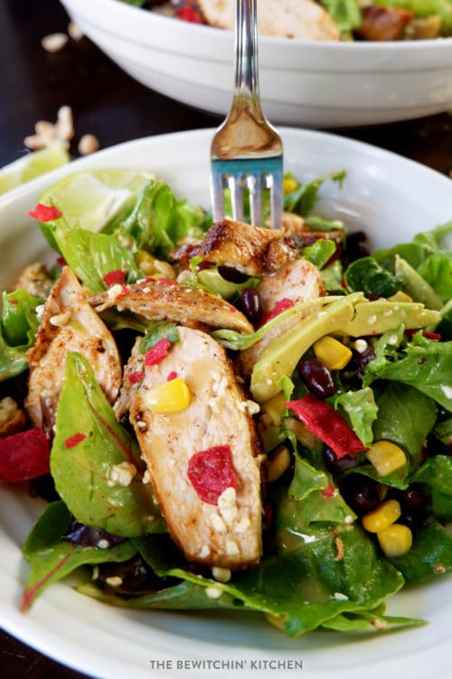 Santa Fe Chicken Salad. Inspired by the Earl's menu, this healthy salad recipe grilled blackened chicken, feta, peanuts, dates, tortilla strips, avocado, and topped with a peanut lime vinaigrette. 