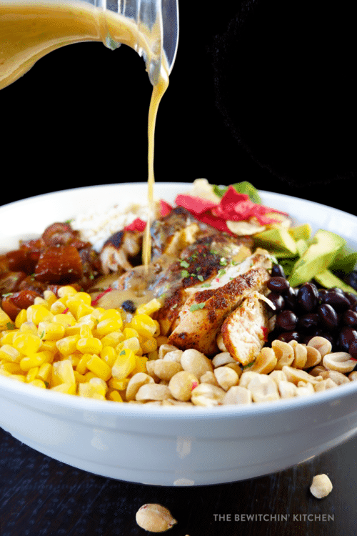 Santa Fe Chicken Salad. Inspired by the Earl's menu, this copycat salad recipe grilled blackened chicken, feta, peanuts, dates, tortilla strips, avocado, and topped with a peanut lime vinaigrette.