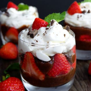 Two ingredients make up this chocolate protein pudding, make it a parfait and a healthy dessert by adding strawberries and homemade whipped cream.