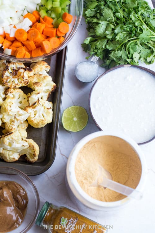 Roasted vegetables laying in a pan with cilantro and bone broth powder.