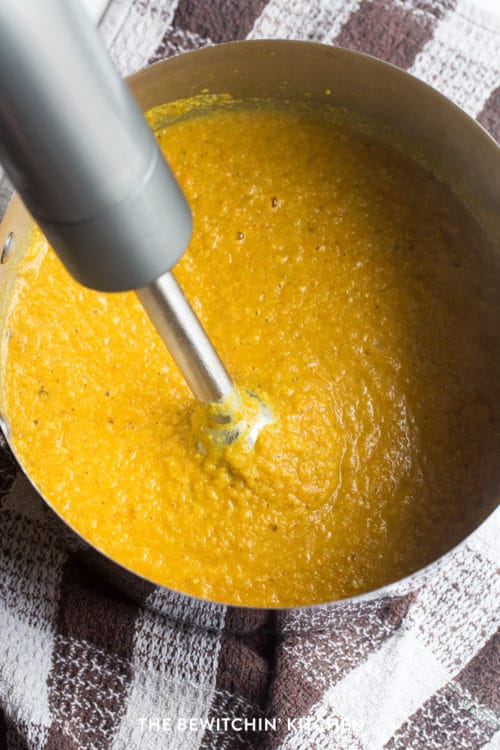 Immersion blender in pureed cauliflower soup