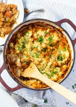 overhead: large pot of chicken shepherd's pie with wooden spoon