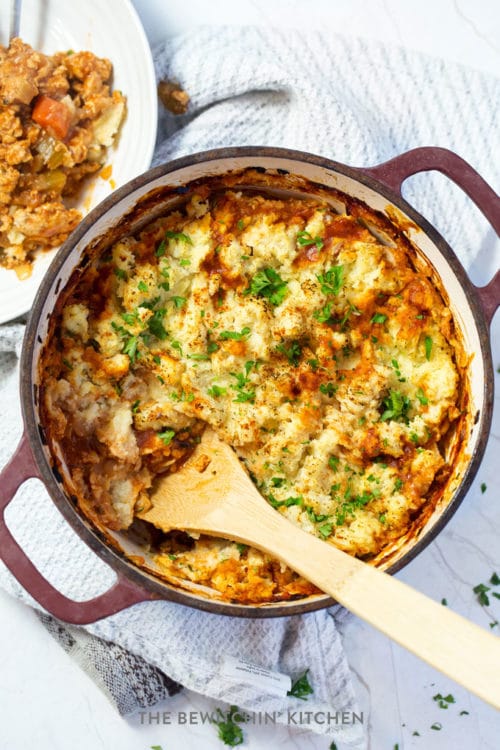 overhead: large pot of chicken shepherd's pie with wooden spoon