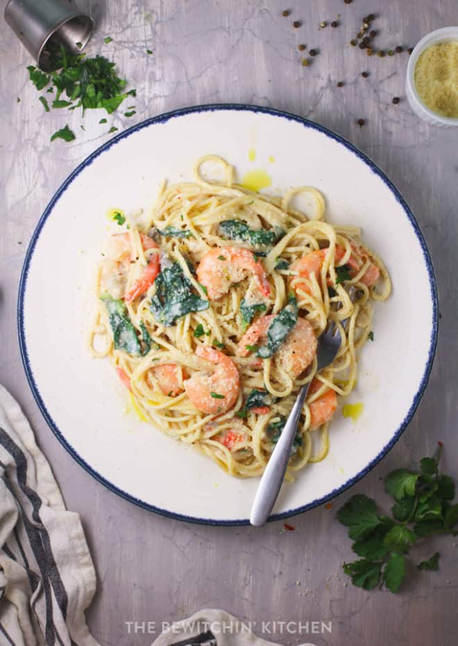 healthy alfredo sauce over noodles, shrimp, spinach, and peppers