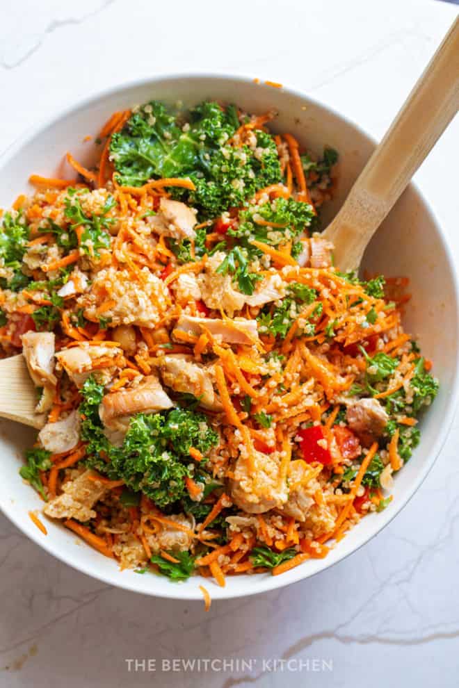 Shredded carrots, kale, chicken, chickpeas, peppers in a moroccan salad bowl