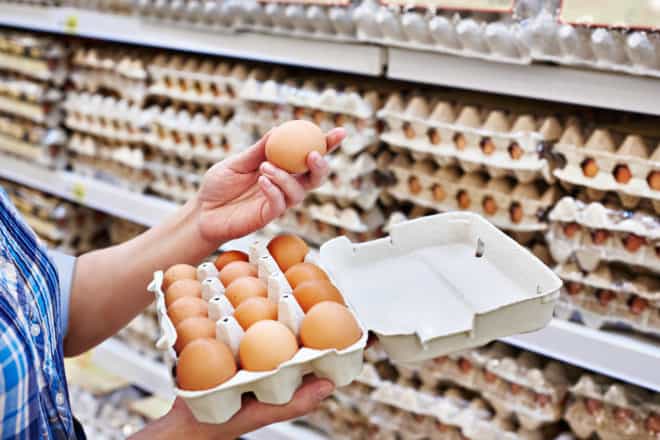 checking out eggs in the grocery store