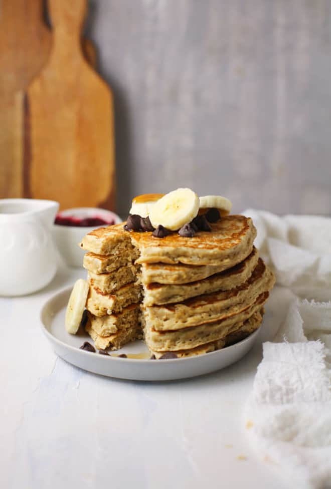 fluffy pancakes topped with berries and bananas