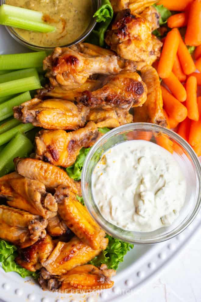 healthy hot wings recipe with a ranch dipping sauce and carrots