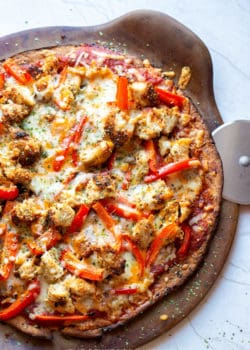 homemade chicken parmesan pizza on a hot pizza stone