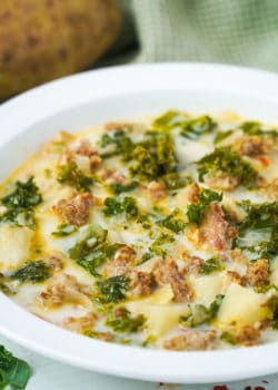 bowl full of a creamy sausage and kale soup