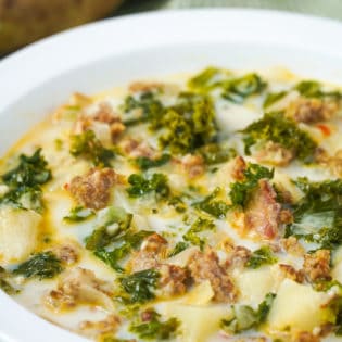 bowl full of a creamy sausage and kale soup