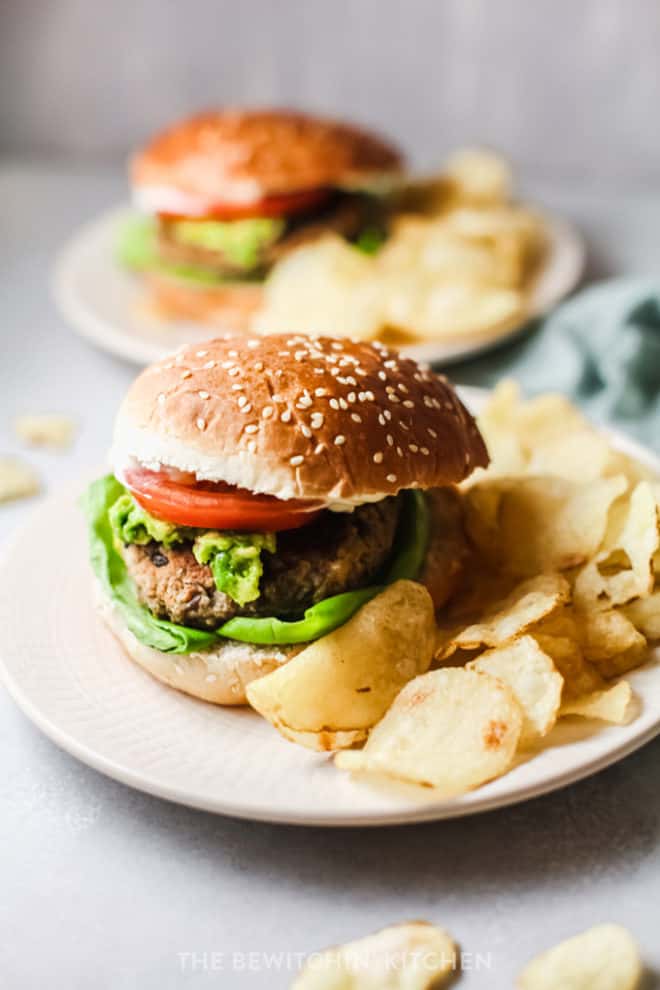 plant based black bean burgers served with guacamole and chips